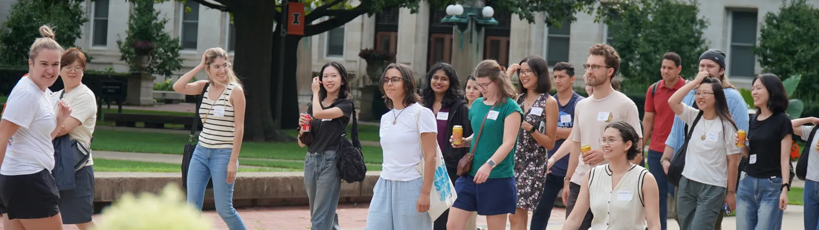 A group of new students on a tour of the Main Quad