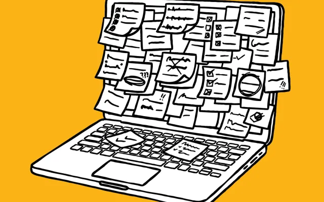 Laptop with post-it notes on the screen