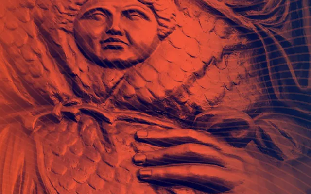 Statue colored orange and blue with hand on hip.