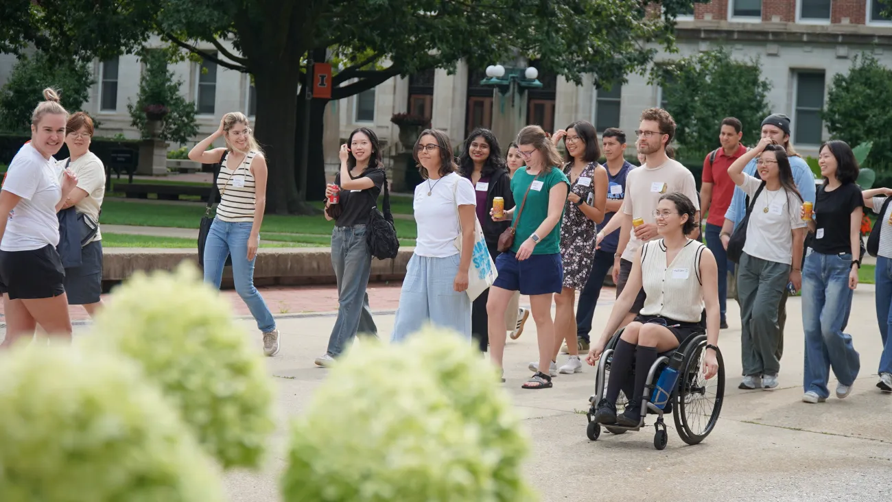 A group of new students on a tour of the Main Quad