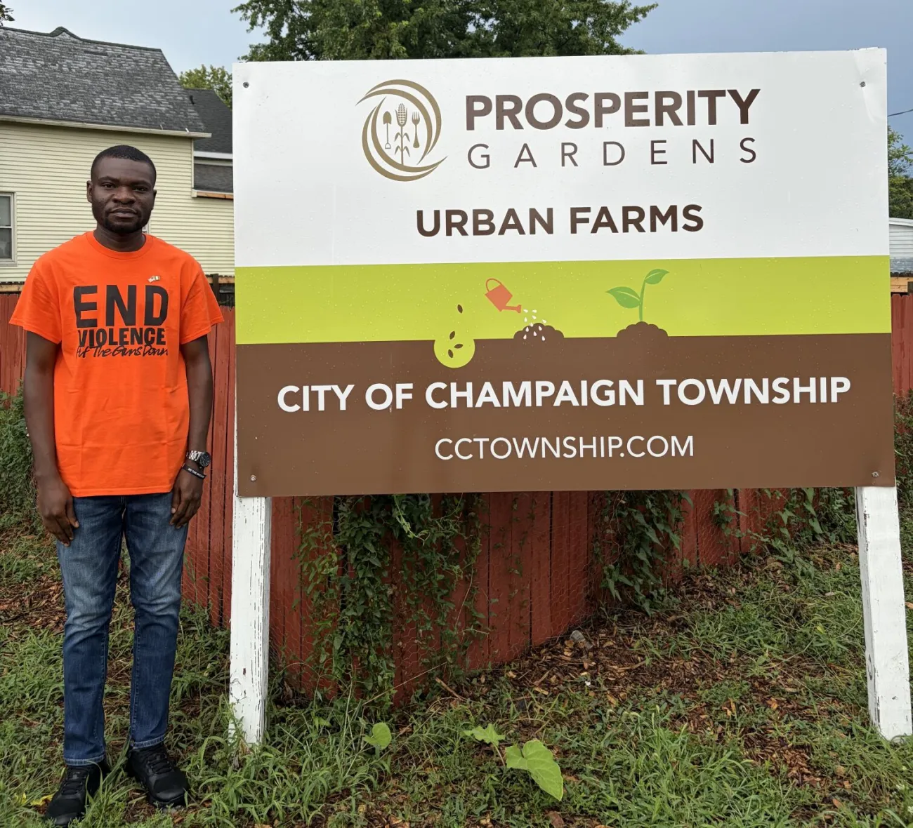 Johnson Opeyemi Adegbola standing in front of the Prosperity Gardens